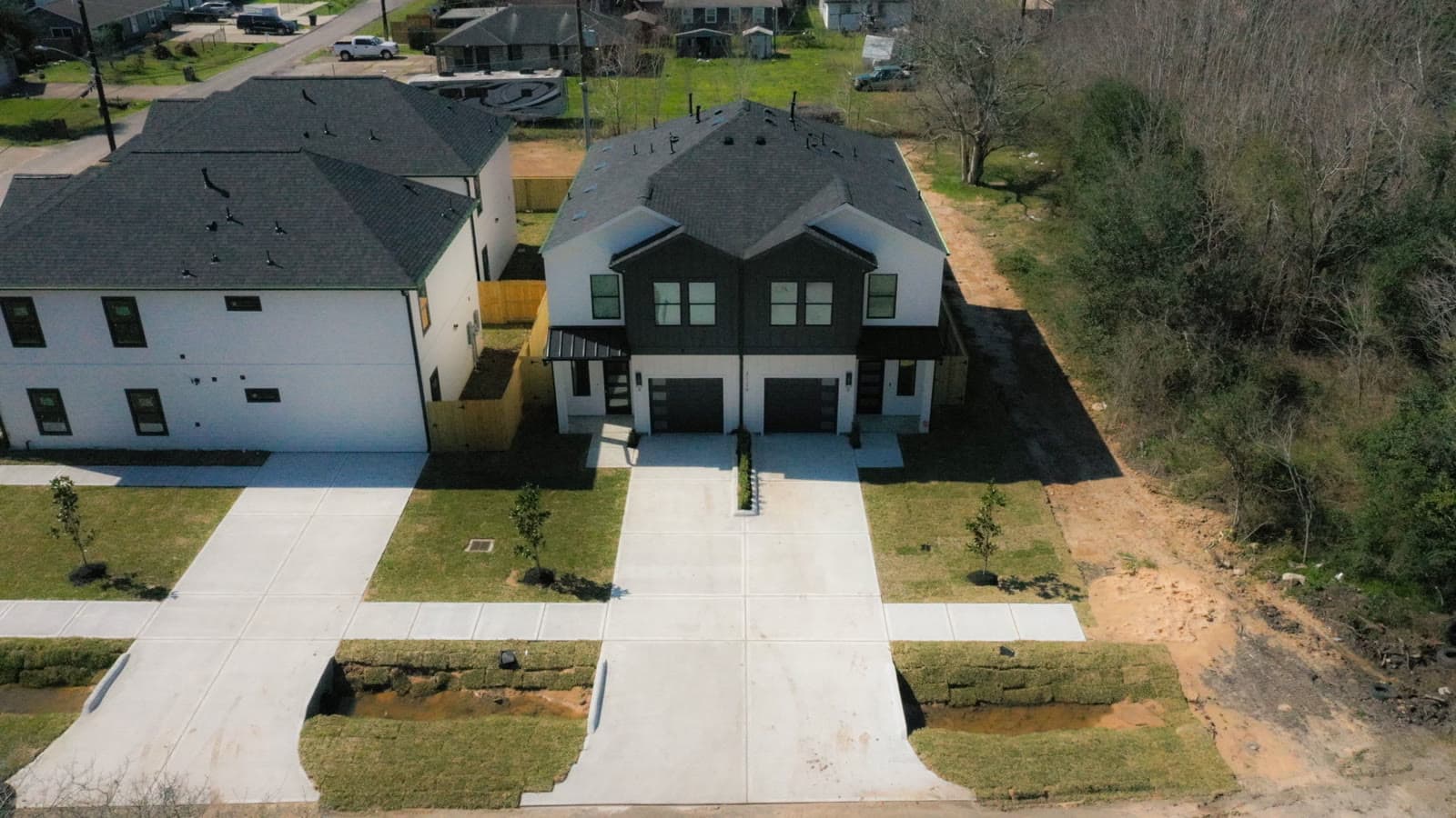 3126 Erica Ln — From concrete flatwork and dry-in to a finished modern-farmhouse duplex with fresh sod and full driveways — delivered complete.