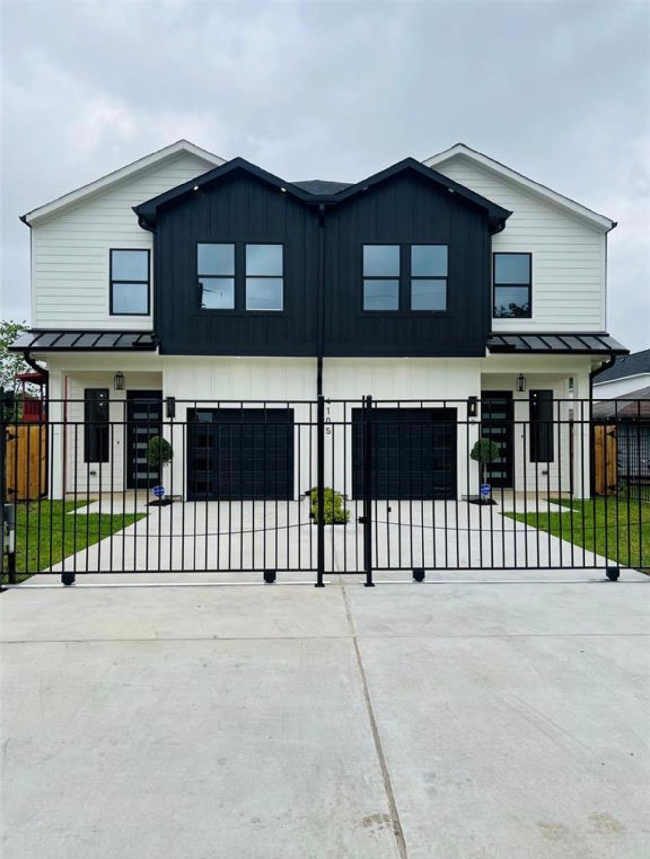 4105 Kewanee St — Black-and-white farmhouse duplex taken through final punch-out to a fully gated, move-in-ready finish.