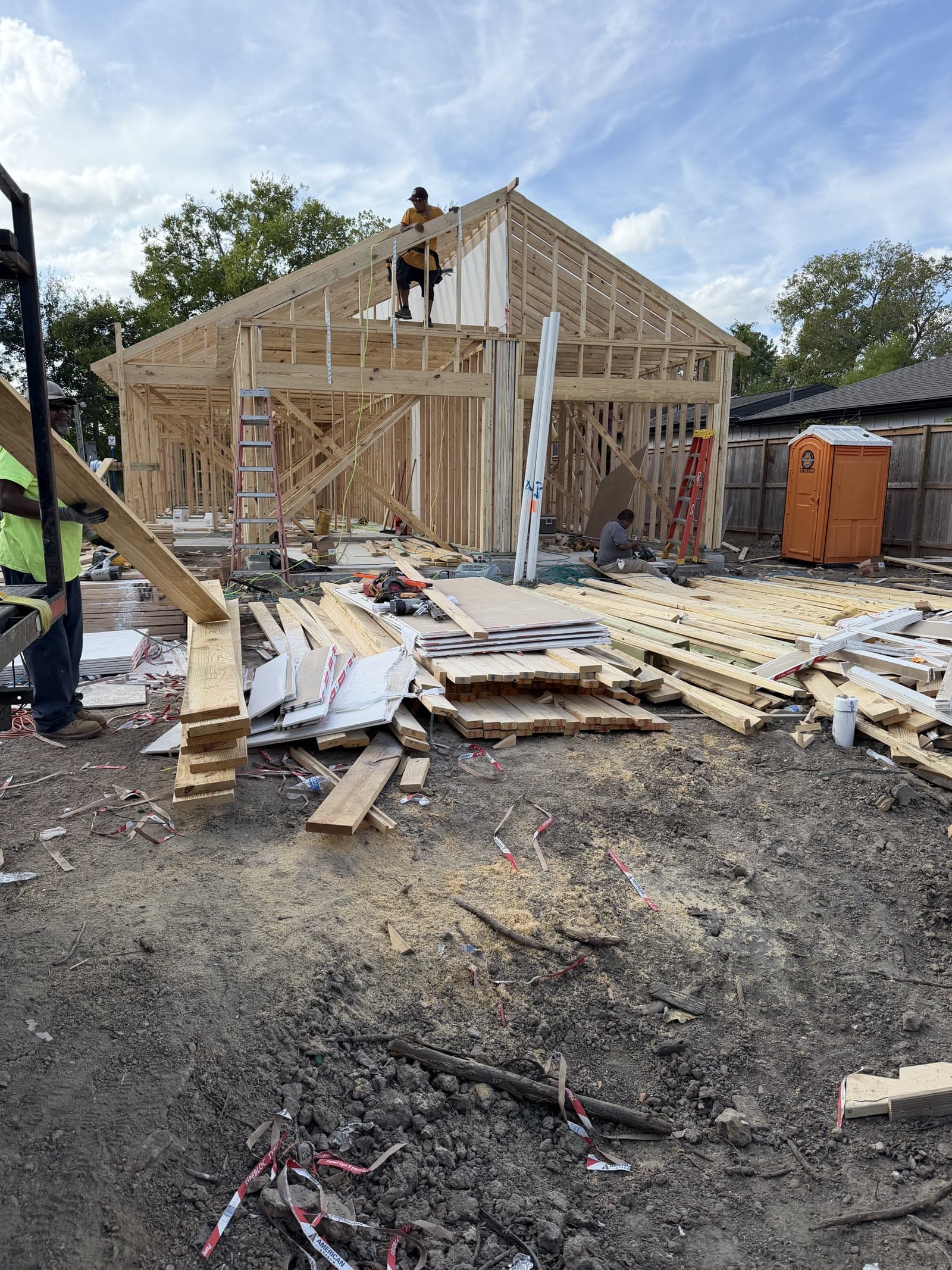 5921 Mountwood St — A ground-up duplex documented from day one — foundation and rebar, slab pour, full framing, cornice, and siding, every stage on camera.